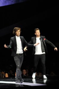 Harry Styles and Louis Tomlinson of One Direction | © Matt Kent / Getty Images